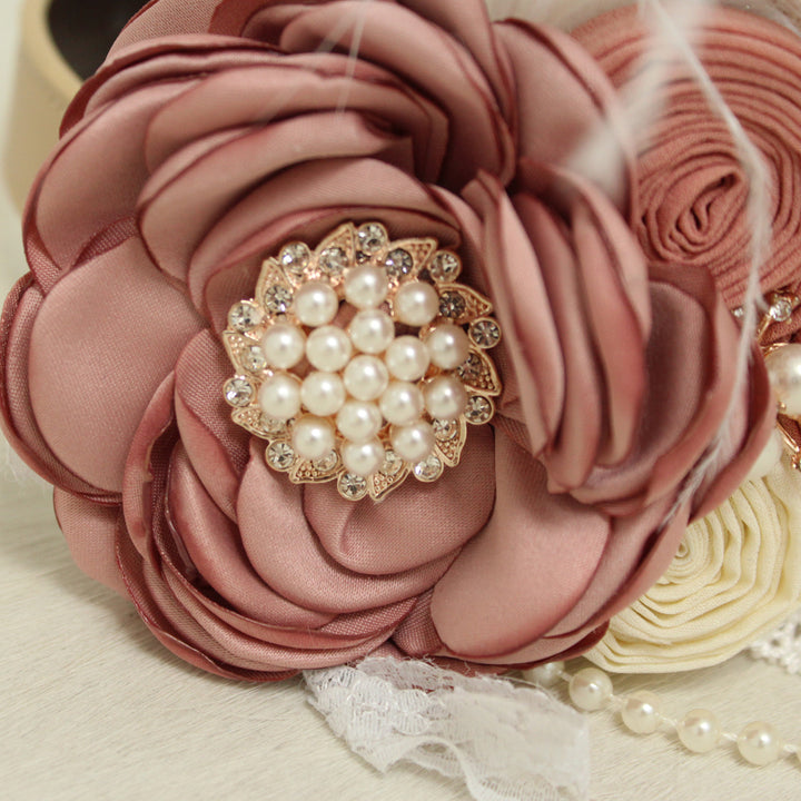 Close-up of dusty rose flower dog wedding collar featuring pearl and crystal centerpiece with handmade floral details.