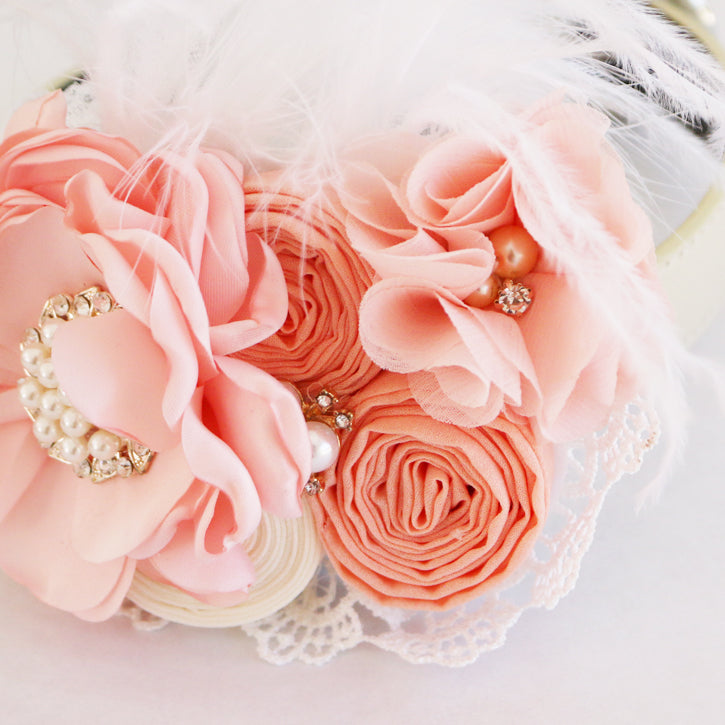 Peach floral ring bearer dog collar with lace, pearls, feathers, and decorative flower arrangement.