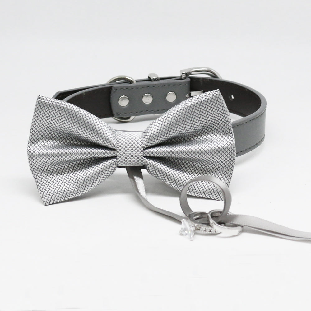 Silver textured ring bearer dog bow tie attached to a black vegan leather collar with wedding ring holder ribbon.