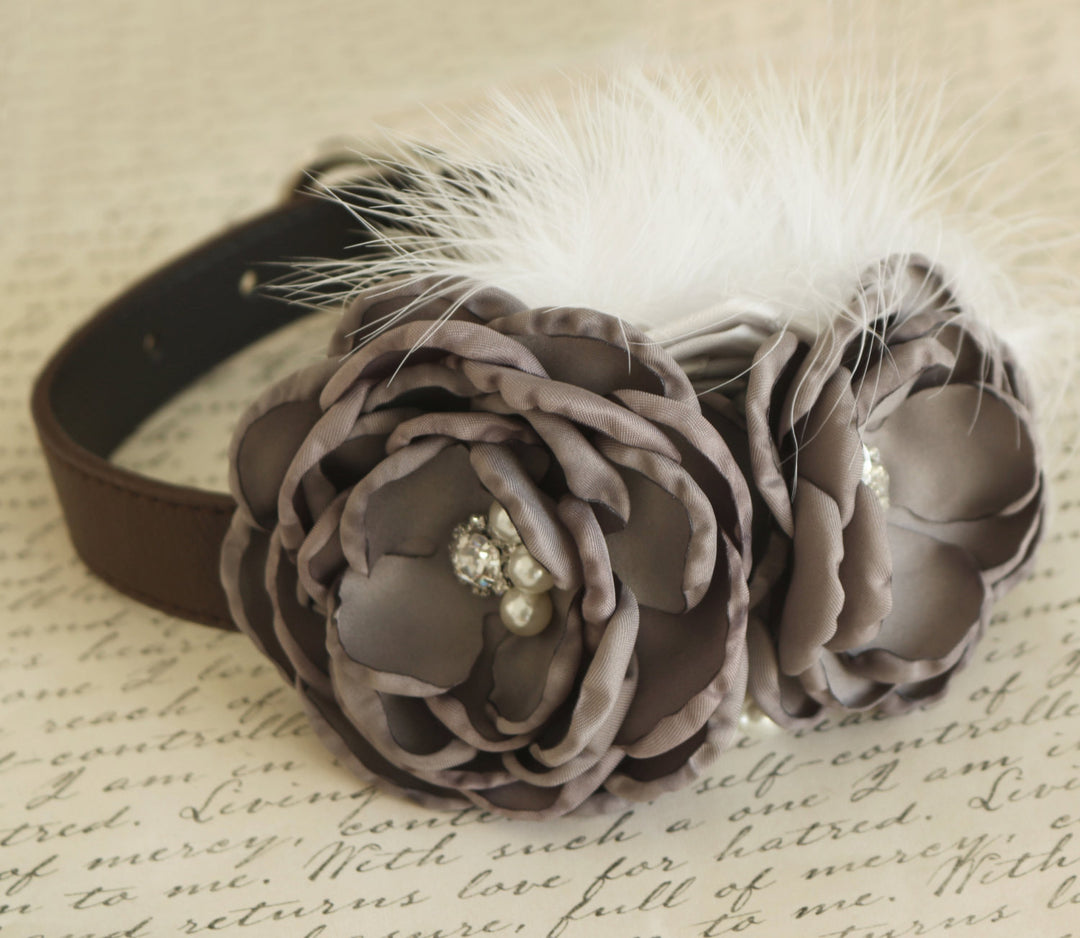 Dog collar featuring taupe fabric flowers, pearl embellishments, white feather accents, and brown vegan leather collar