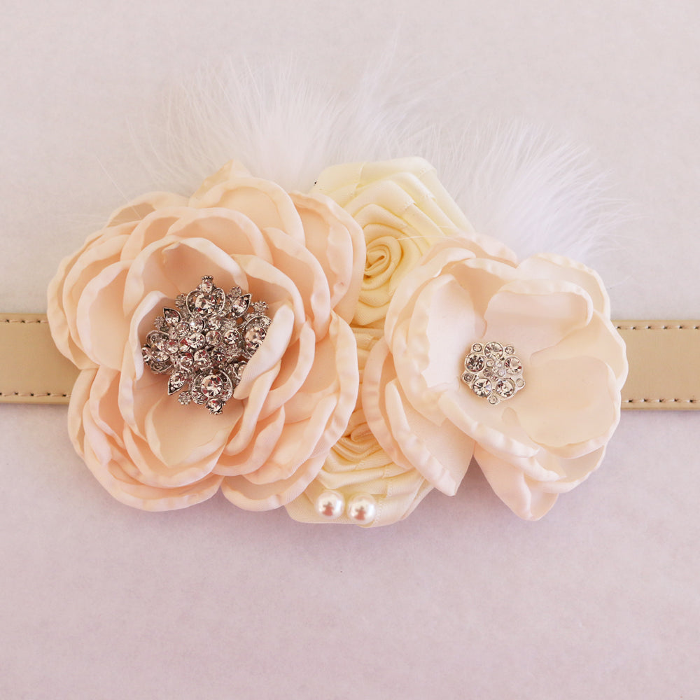 Vintage blush flower dog collar featuring layered fabric blooms, crystal embellishments, soft feather details, and handmade wedding-inspired design.
